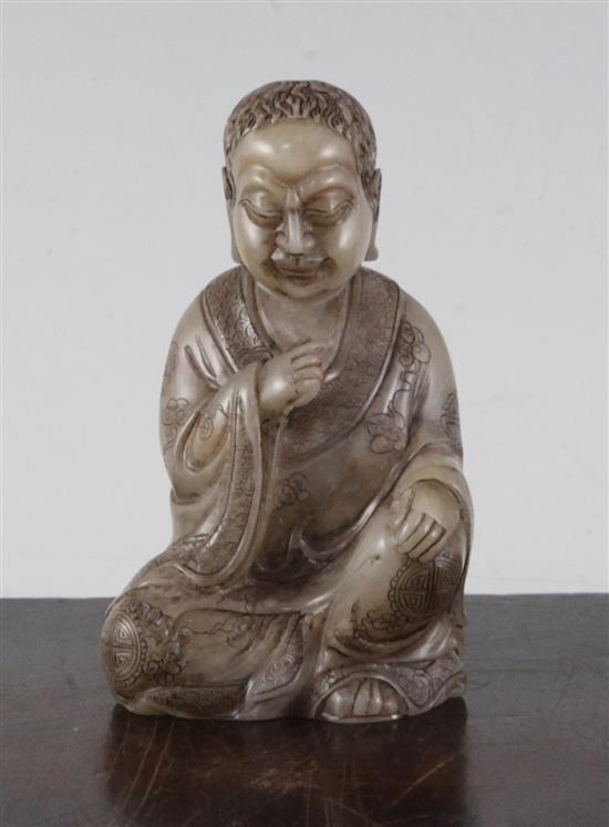 A Chinese soapstone seated figure of Luohan, 8.5cm
